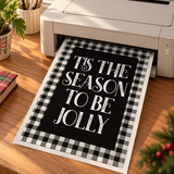 Black and white buffalo plaid Christmas artwork emerging from a home printer
