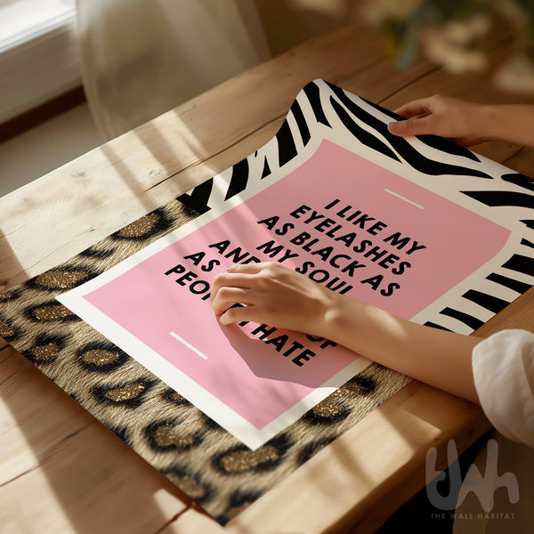 Leopard print quote wall art with pink centre reading “I like my eyelashes as black as my soul” in bold black typography.