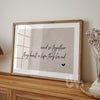 Close-up of romantic neutral wall print saying “And so together they built a life they loved” on soft beige background
