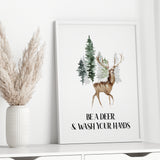 Funny Christmas bathroom printable featuring watercolour deer and green evergreen forest in white frame