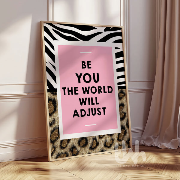 Pink motivational wall art reading “Be You The World Will Adjust” with leopard print and bold zebra pattern details.