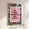 Pink motivational wall art reading “Be You The World Will Adjust” with leopard print and bold zebra pattern details.