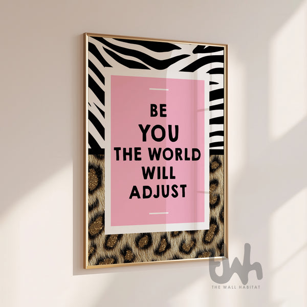 Pink motivational wall art reading “Be You The World Will Adjust” with leopard print and bold zebra pattern details.
