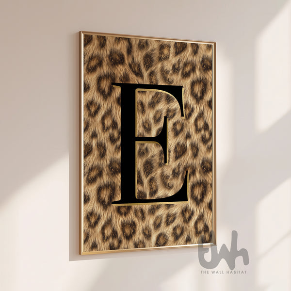 Black initial letter wall art with luxury leopard print background displayed as a modern statement poster