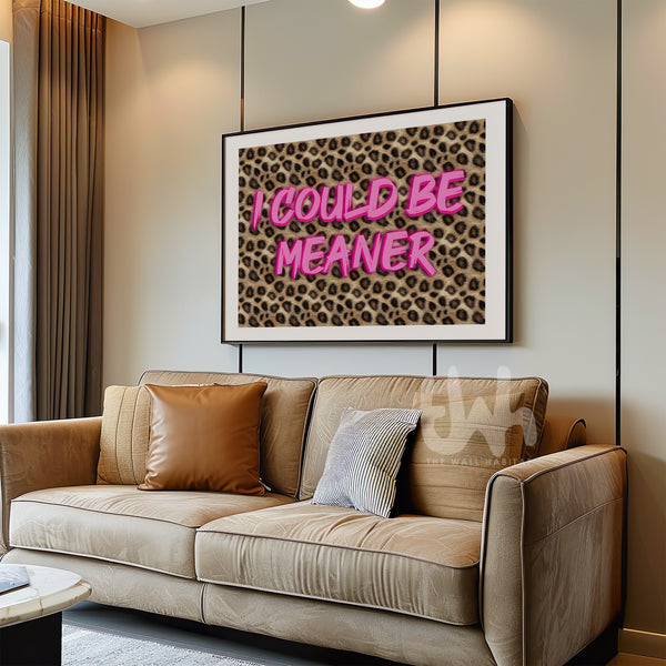 Pink leopard print wall art with bold typography reading “I Could Be Meaner”, displayed in a modern glam interior.