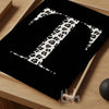 Personalized monogram wall art featuring a bold serif letter 'T' in black and white leopard print on a solid black background, styled on a wooden tray