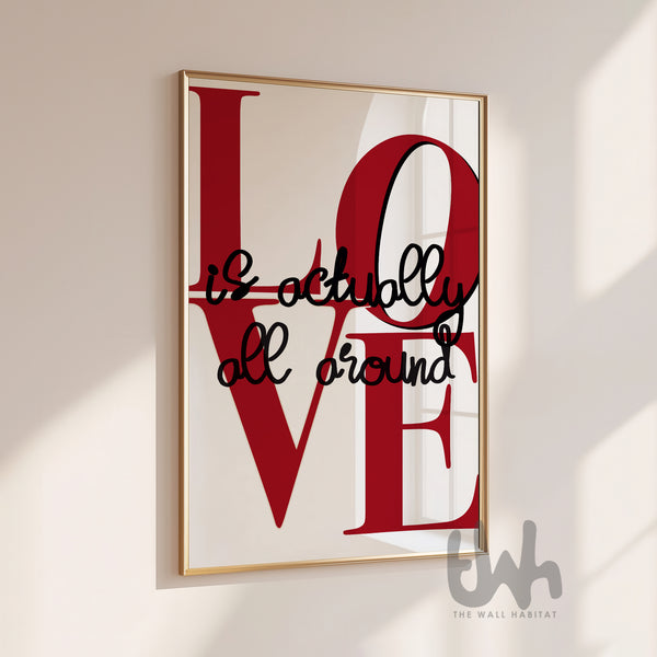 Love Is Actually All Around typography wall art with bold red lettering on white background in gold picture frame
