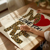 Love you more leopard print wall art with bold typography and red heart design