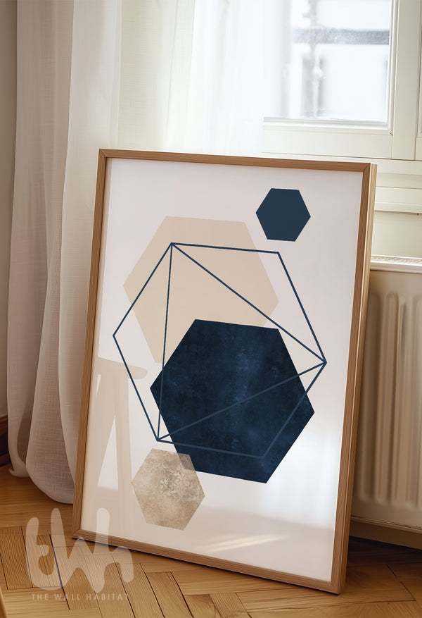 Modern abstract wall art with layered navy, beige, and cream hexagons outlined with geometric navy blue linework, framed in a minimalist home setting.