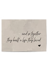 Flat lay of the unframed wall print with romantic message on neutral tones