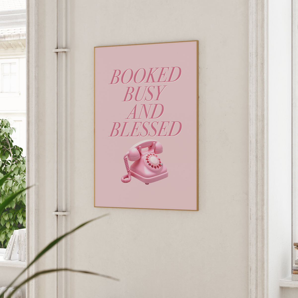 Booked Busy and Blessed pink wall art print with retro telephone illustration styled in a modern living room