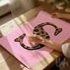 Pink leopard print personalised initial wall art with bold letter design on soft pink background