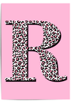 Personalised leopard print initial wall art with pink background displayed in a modern interior