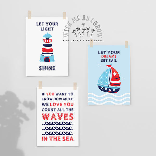 Three nautical-themed art prints for kids, clipped to a light gray wall. The prints feature illustrations of a lighthouse and a sailboat with inspirational quotes: 'LET YOUR LIGHT SHINE', 'LET YOUR DREAMS SET SAIL', and 'IF YOU WANT TO KNOW HOW MUCH WE LOVE YOU COUNT ALL THE WAVES IN THE SEA'.