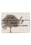 Decorative sign with tree design and text on a checkered background