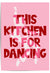 Pink poster with red text 'This kitchen is for dancing' and a silhouette of a dancer.