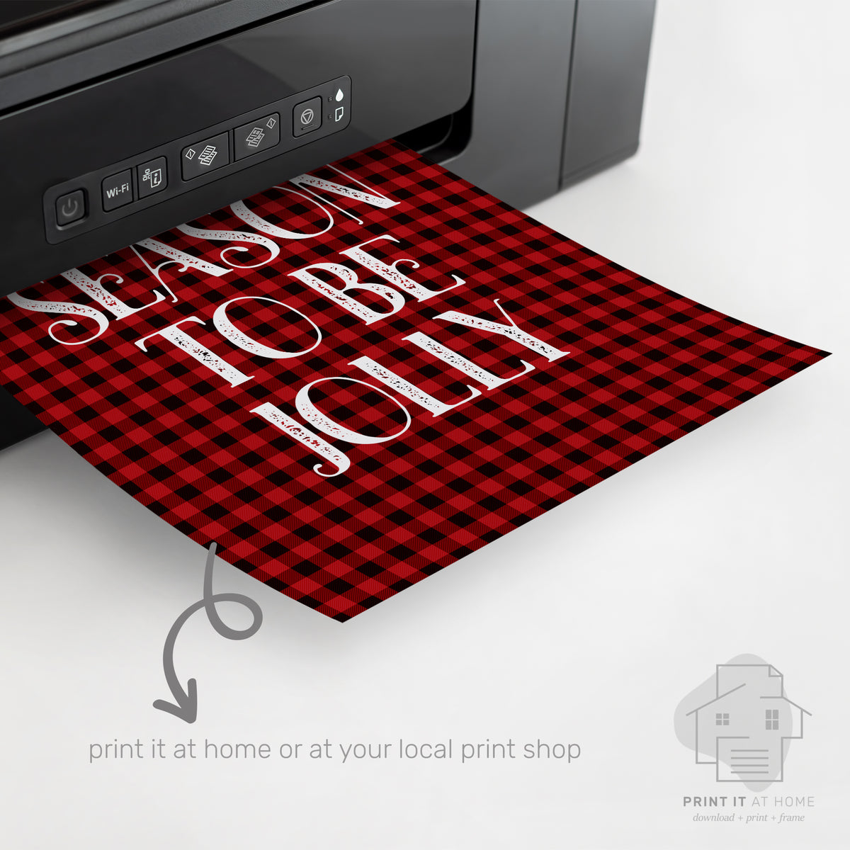 Red buffalo plaid Christmas artwork emerging from a home printer