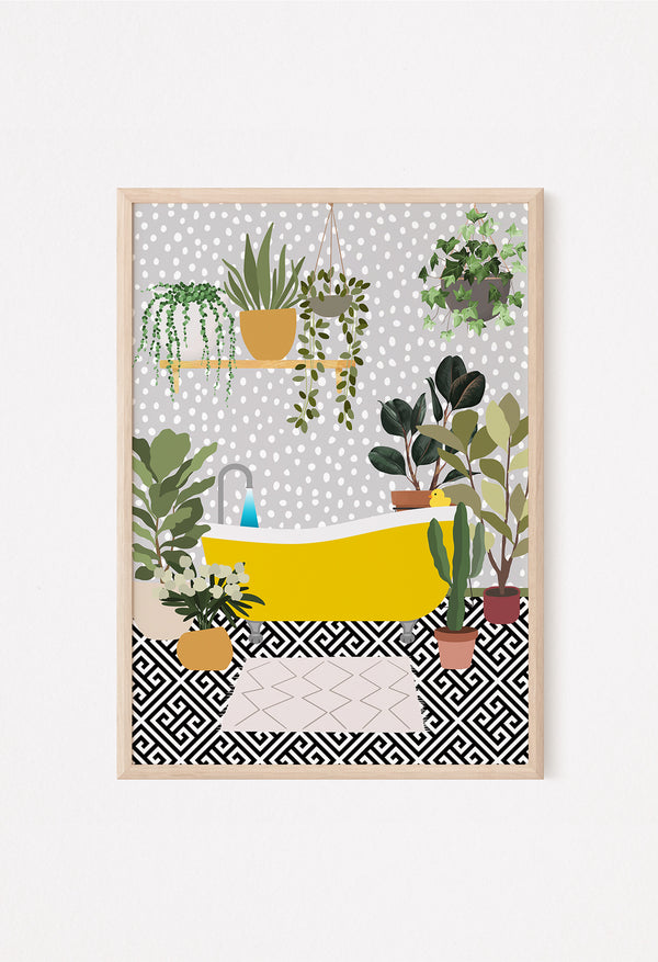 Framed yellow bath wall art styled on a white console with neutral decor and pampas grass