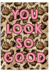 You Look So Good leopard print wall art with pink typography displayed in a gold frame in a modern interior