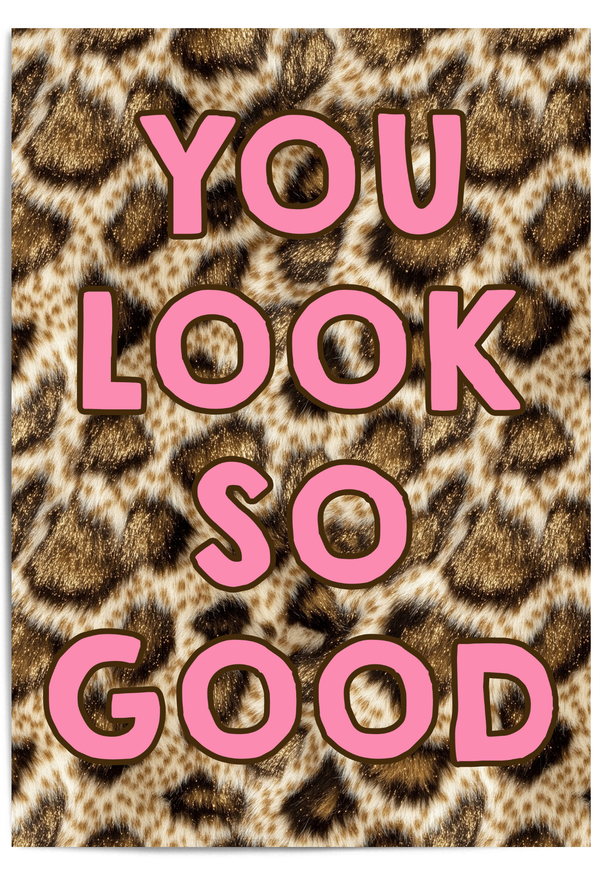 You Look So Good leopard print wall art with pink typography displayed in a gold frame in a modern interior