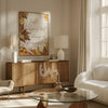 Modern living room with wooden sideboard, white sofa, and decorative wall art.