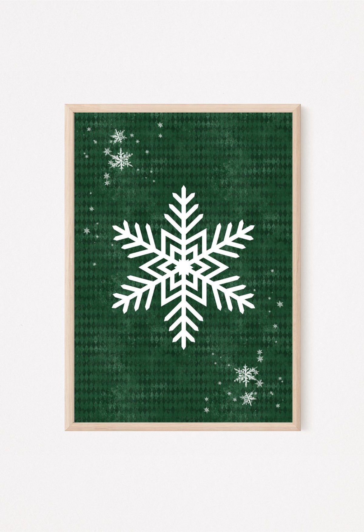 Rustic holiday snowflake artwork in deep green tones