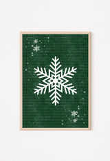 Rustic holiday snowflake artwork in deep green tones