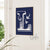 Personalized floral monogram wall art featuring a detailed white letter 'L' with botanical elements on a navy blue background, displayed in a frame