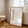 Fall-themed wall art print with a list of autumn favorites like “pumpkins, hay rides, crisp mornings” alongside a watercolor botanical stem, styled in a light wood frame.