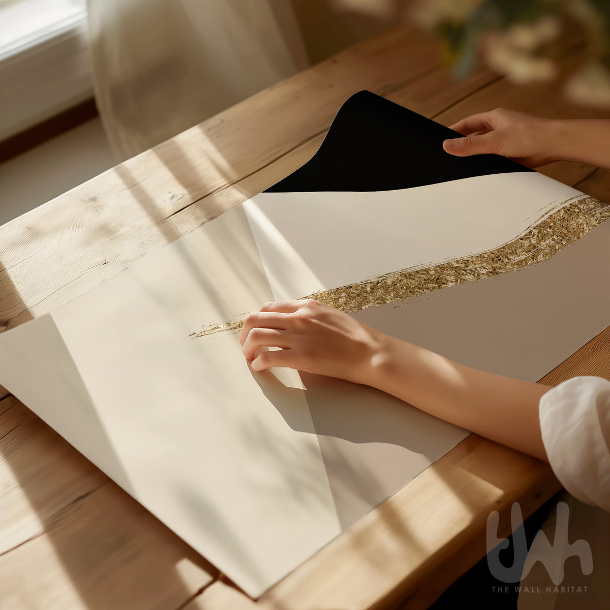 Neutral geometric wall art with black beige and gold-effect detail