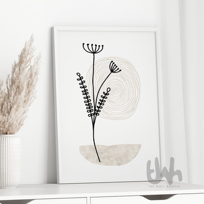 Framed neutral botanical line art print styled on a white cabinet with dried pampas grass – soft modern home décor