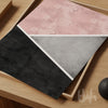Blush pink, grey and charcoal abstract geometric wall art print featuring diagonal colour blocking and textured finish.