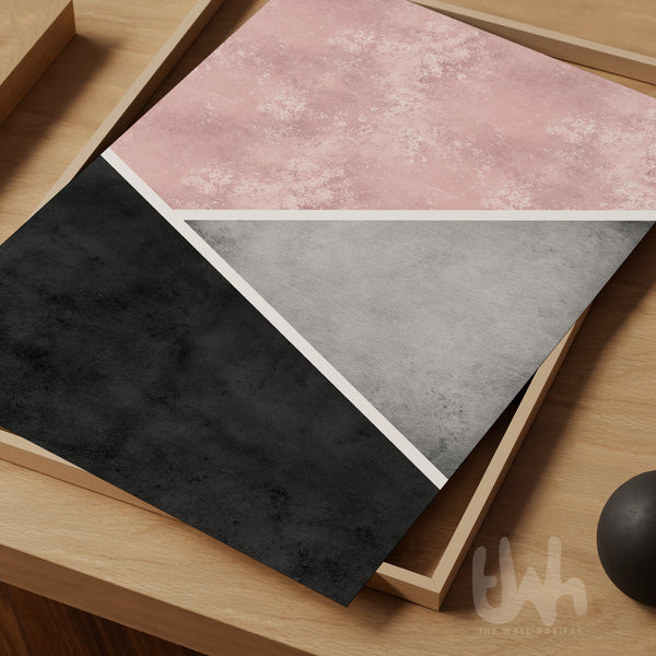 Blush pink, grey and charcoal abstract geometric wall art print featuring diagonal colour blocking and textured finish.