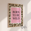 Born to be wild pink leopard print wall art framed in a modern interior