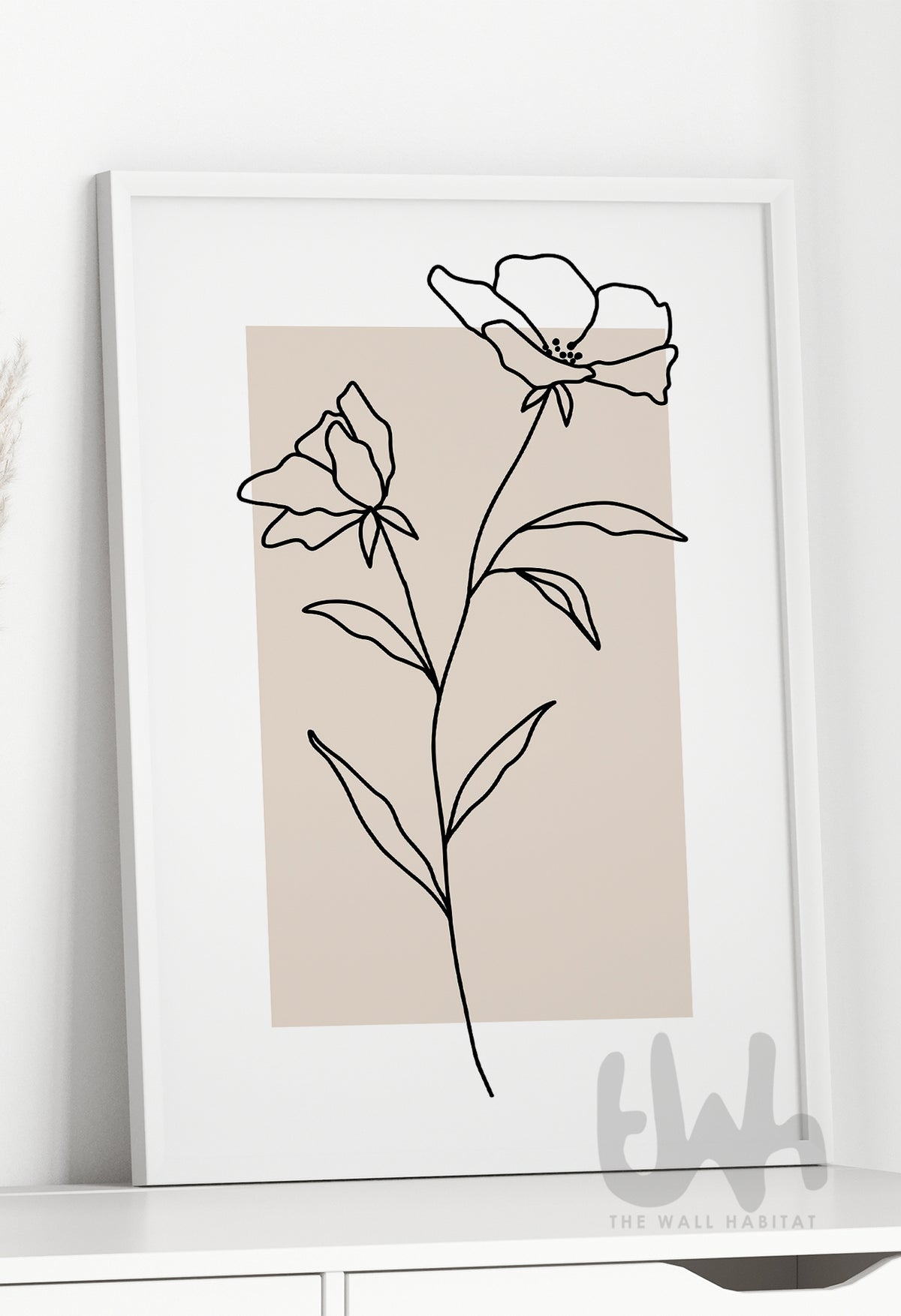 Minimalist botanical line art print featuring two abstract flowers drawn in black continuous line style over a neutral beige background, framed and styled for modern interior decor