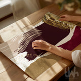 Burgundy and beige abstract wall art with geometric brushstroke design