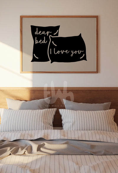 Above-the-bed wall art with playful quote ‘Dear Bed, I Love You’ framed and styled in a modern bedroom with soft morning light