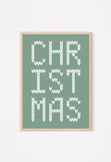 Framed Christmas-themed artwork with 'CHRISTMAS' text on a green background