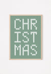 Framed Christmas-themed artwork with 'CHRISTMAS' text on a green background