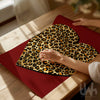 Leopard heart wall art print with gold leopard pattern on a deep red background 