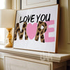 Framed artwork with 'LOVE YOU MORE' text on a mantelpiece.