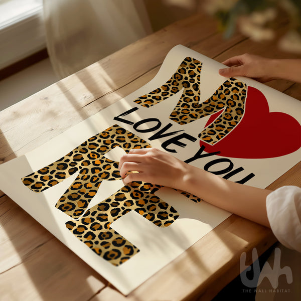 Love you more leopard print wall art with bold typography and red heart design