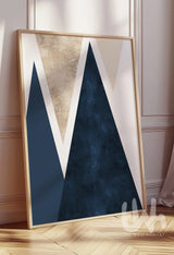 Framed abstract art piece with geometric design on a wall.
