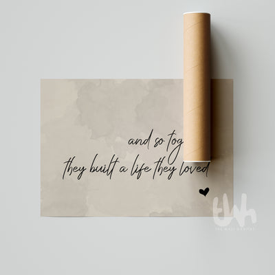 Close-up of romantic neutral wall print saying “And so together they built a life they loved” on soft beige background