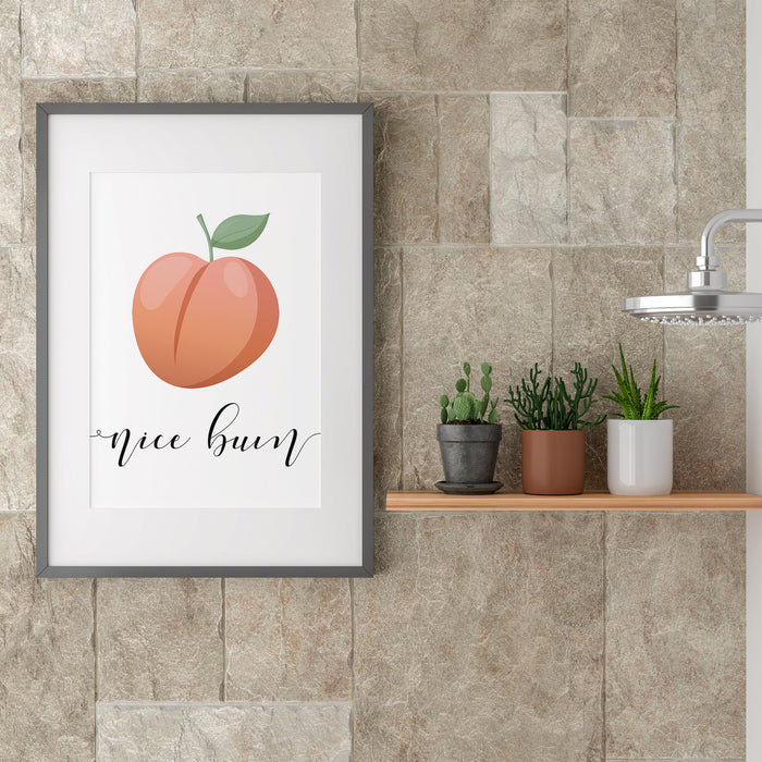 Nice Bum peach printable bathroom wall art displayed beside shower