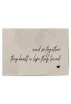 Flat lay of the unframed wall print with romantic message on neutral tones
