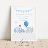 A framed baby shower print leaning against a white wall on a light wood floor. The print features a white background with a blue bunting banner, the phrase 'First we had each other THEN WE HAD YOU Now we have everything' in gray and blue script, three cute elephants in shades of blue and gray, and a blue balloon.