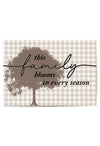 Decorative sign with tree design and text on a checkered background