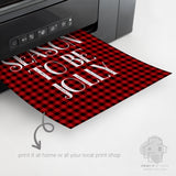 Red buffalo plaid Christmas artwork emerging from a home printer
